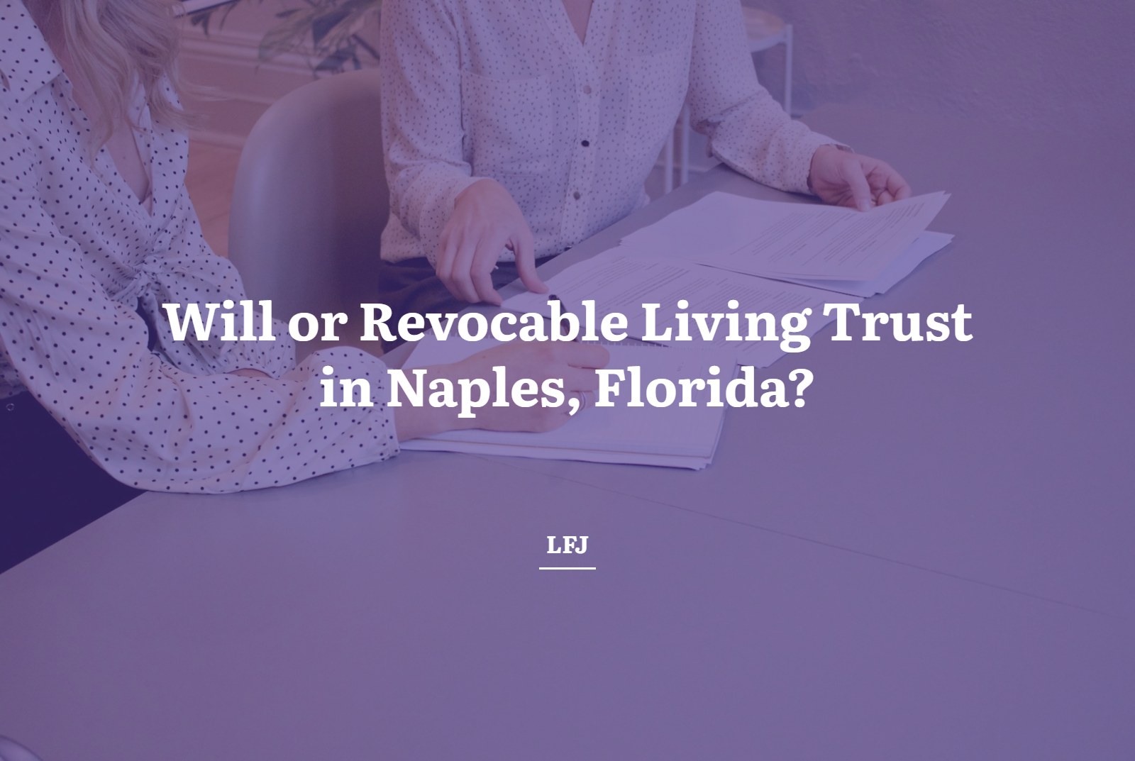 Two people reviewing and signing estate planning documents at a table